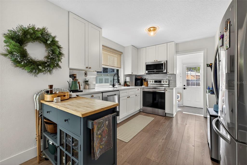 2220 7th Avenue North St. Petersburg, FL 33713 - Photo 9 of 31 a kitchen with a sink stove and refrigerator