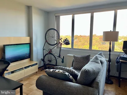 a living room with furniture and a large window