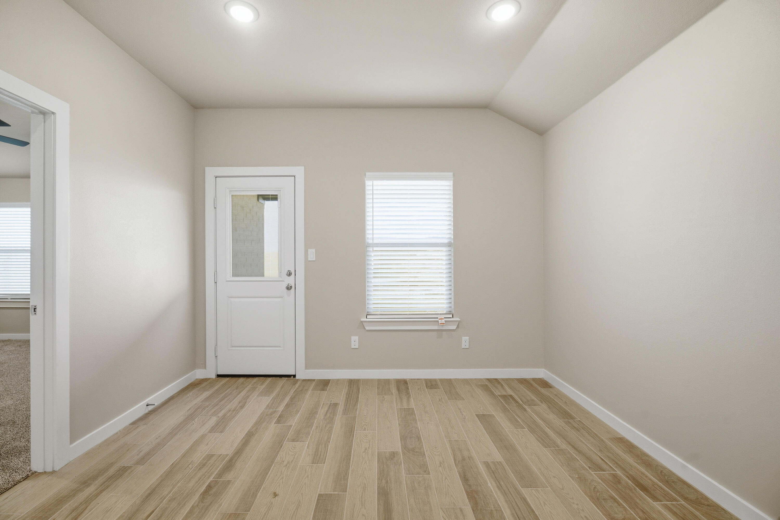618 East 13th Street Wolfforth, TX 79382 - Photo 15 of 33 an empty room with a hardwood and wooden floor