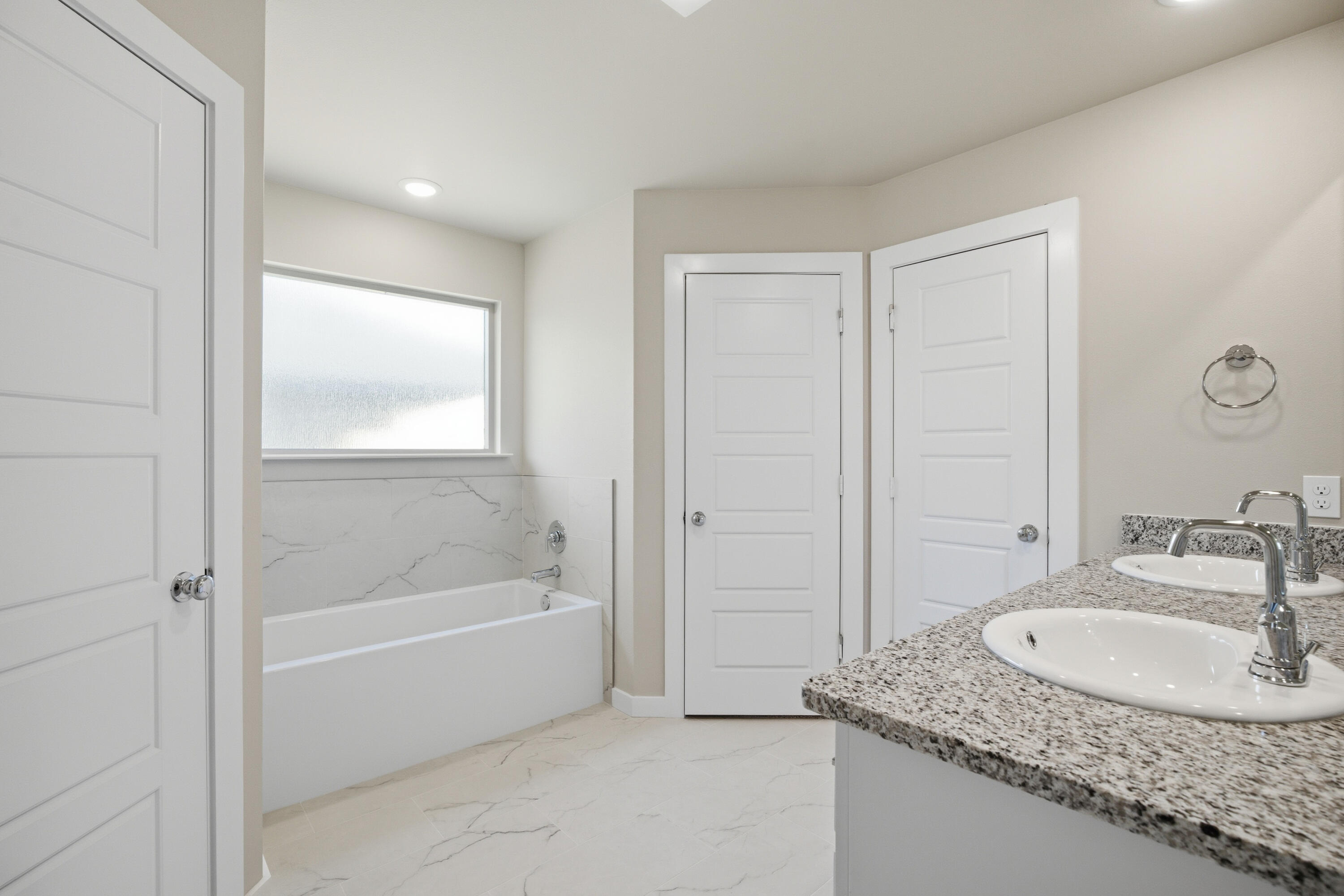 618 East 13th Street Wolfforth, TX 79382 - Photo 19 of 33 a bathroom with a granite countertop tub a sink and a mirror