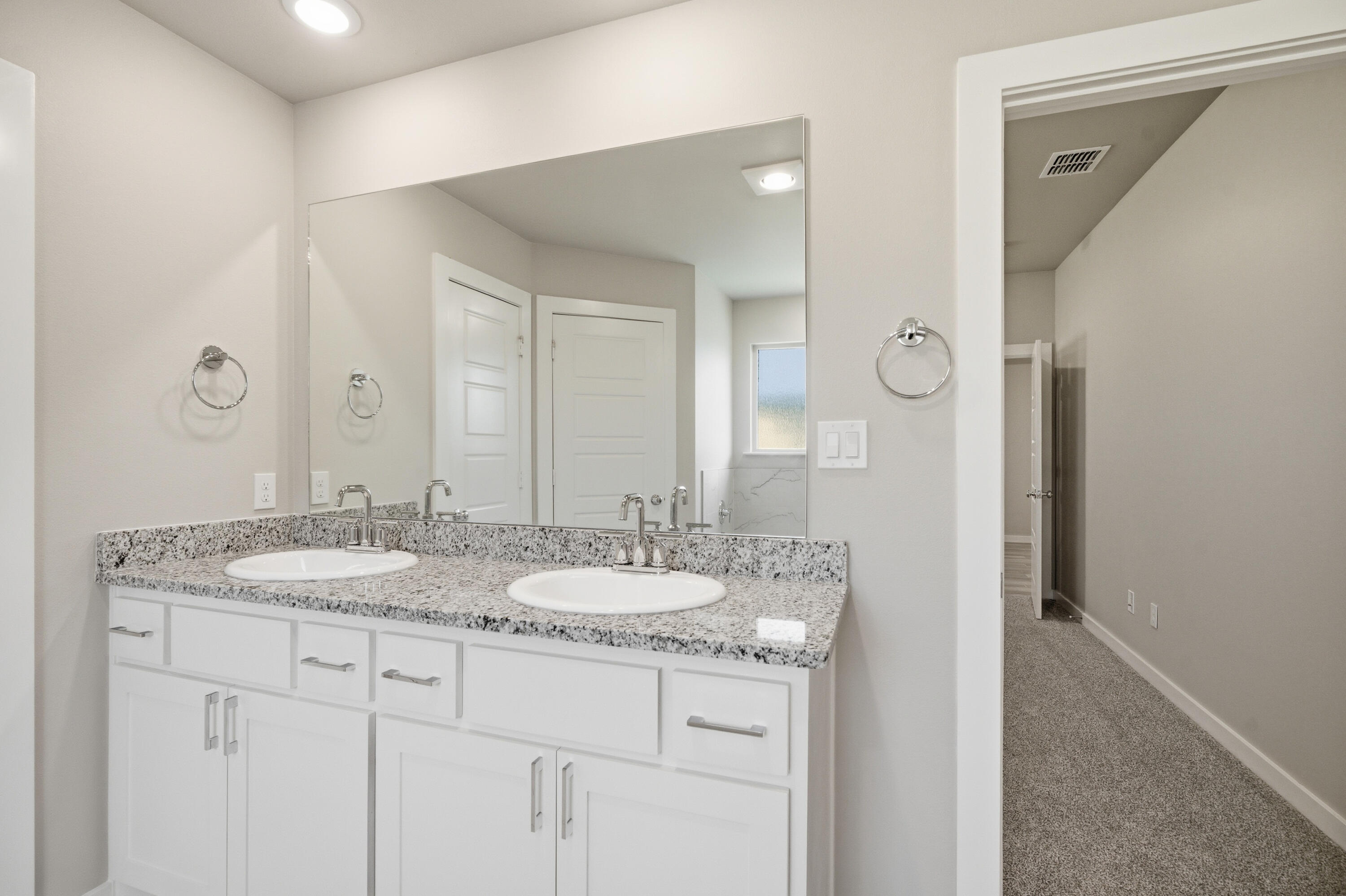 618 East 13th Street Wolfforth, TX 79382 - Photo 20 of 33 a bathroom with a granite countertop sink and a mirror