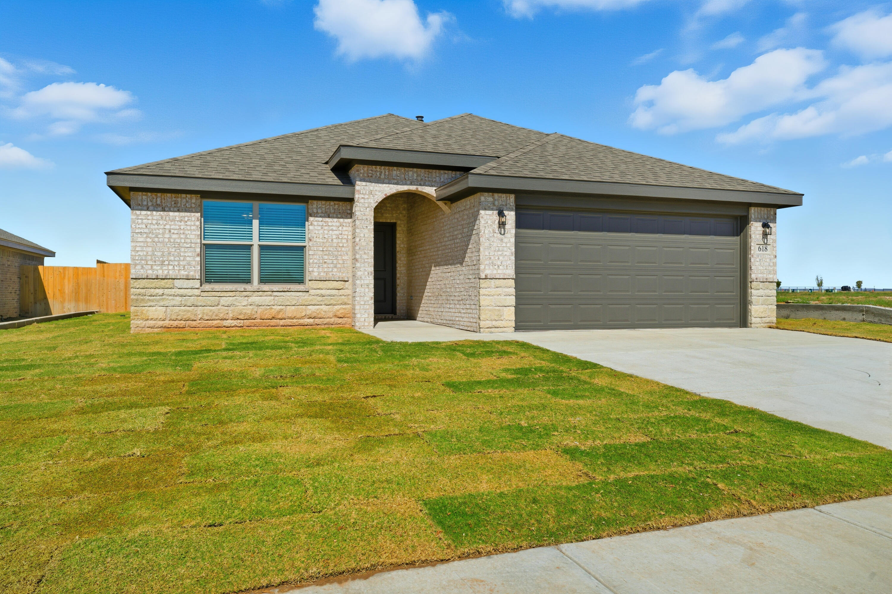 618 East 13th Street Wolfforth, TX 79382 - Photo 2 of 33 a front view of a house with a yard