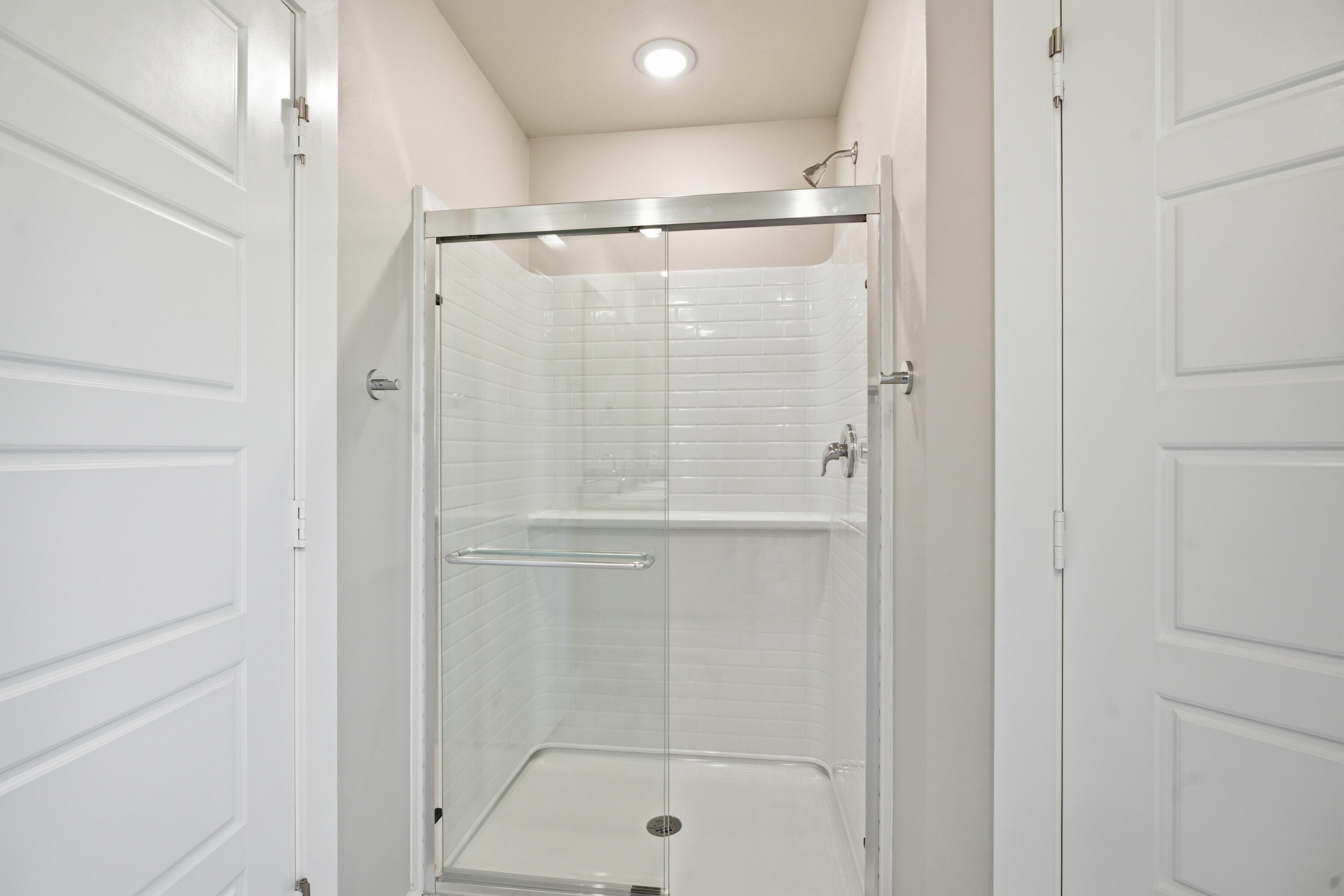 618 East 13th Street Wolfforth, TX 79382 - Photo 21 of 33 a bathroom with a glass shower door