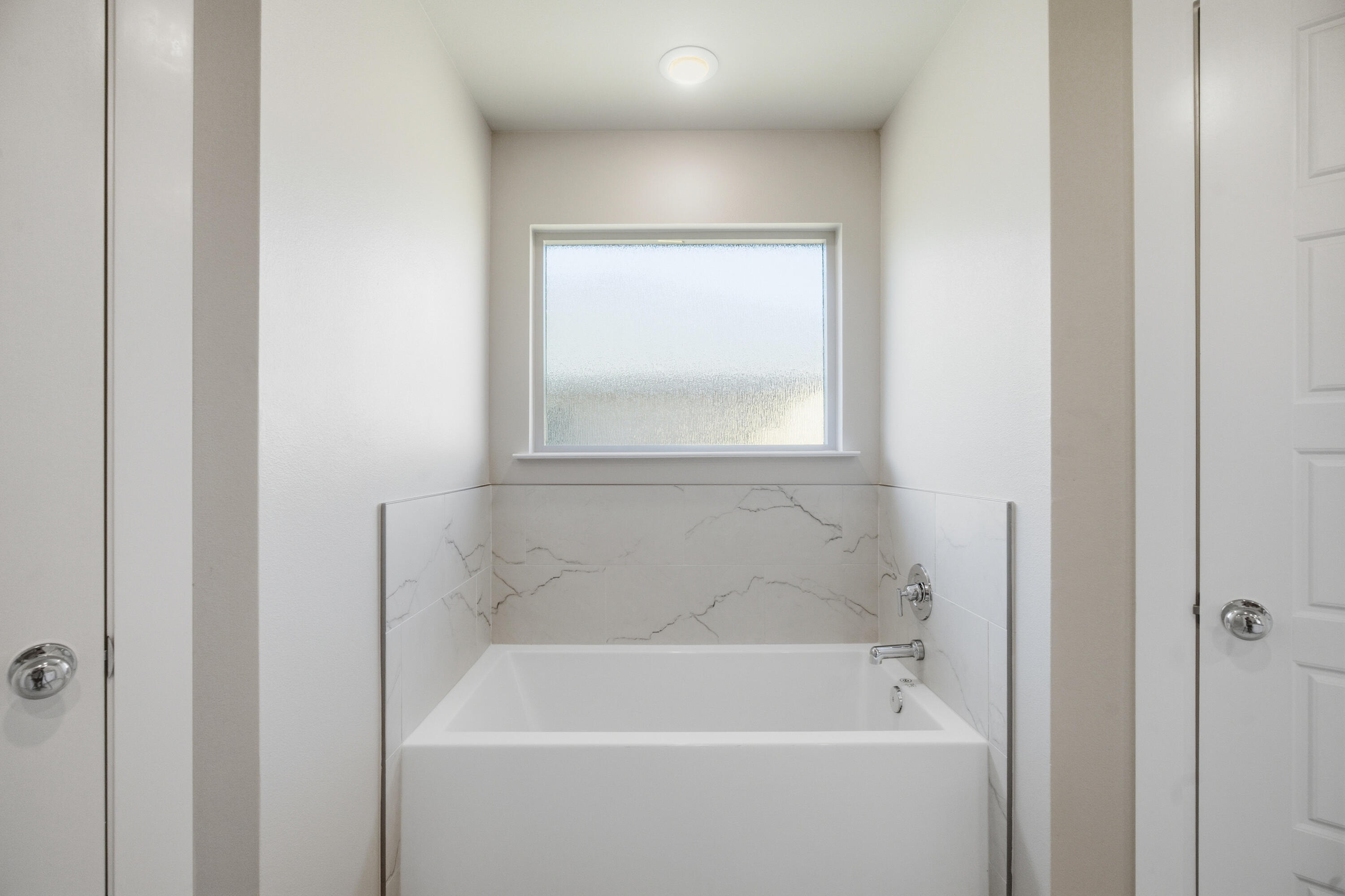 618 East 13th Street Wolfforth, TX 79382 - Photo 22 of 33 a white bath tub sitting next to a window