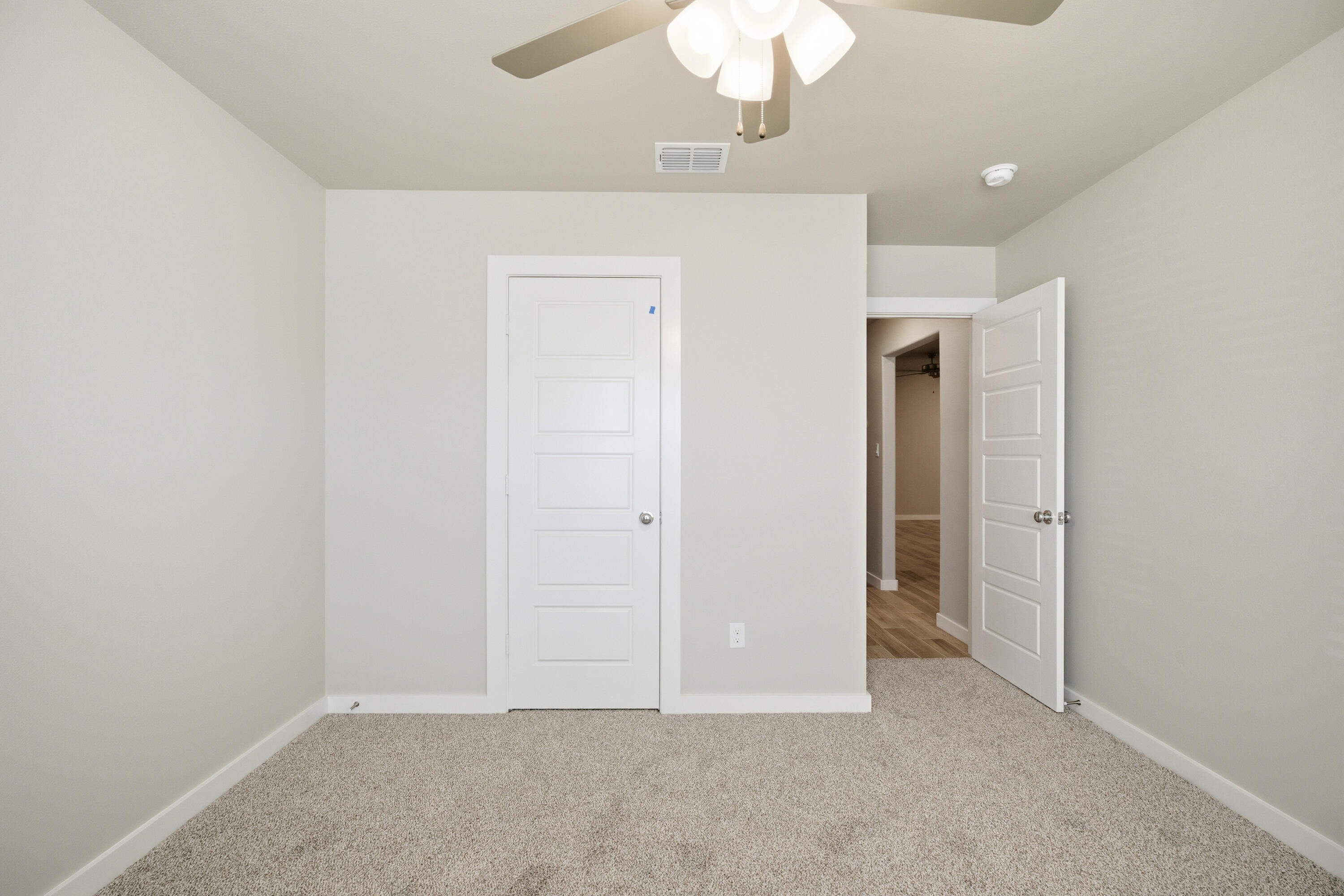 618 East 13th Street Wolfforth, TX 79382 - Photo 26 of 33 an empty room with a chandelier fan