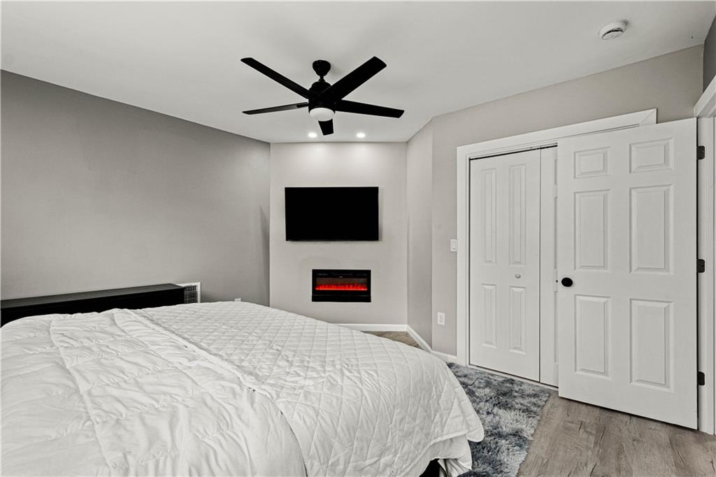 214 North Aiken Avenue Pittsburgh, PA 15206 - Photo 19 of 37 Second-floor bedroom with electric fireplace and closet