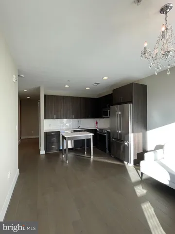 a view of a room with kitchen view and appliances