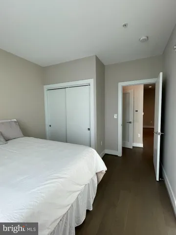 a bedroom with a bed and closet