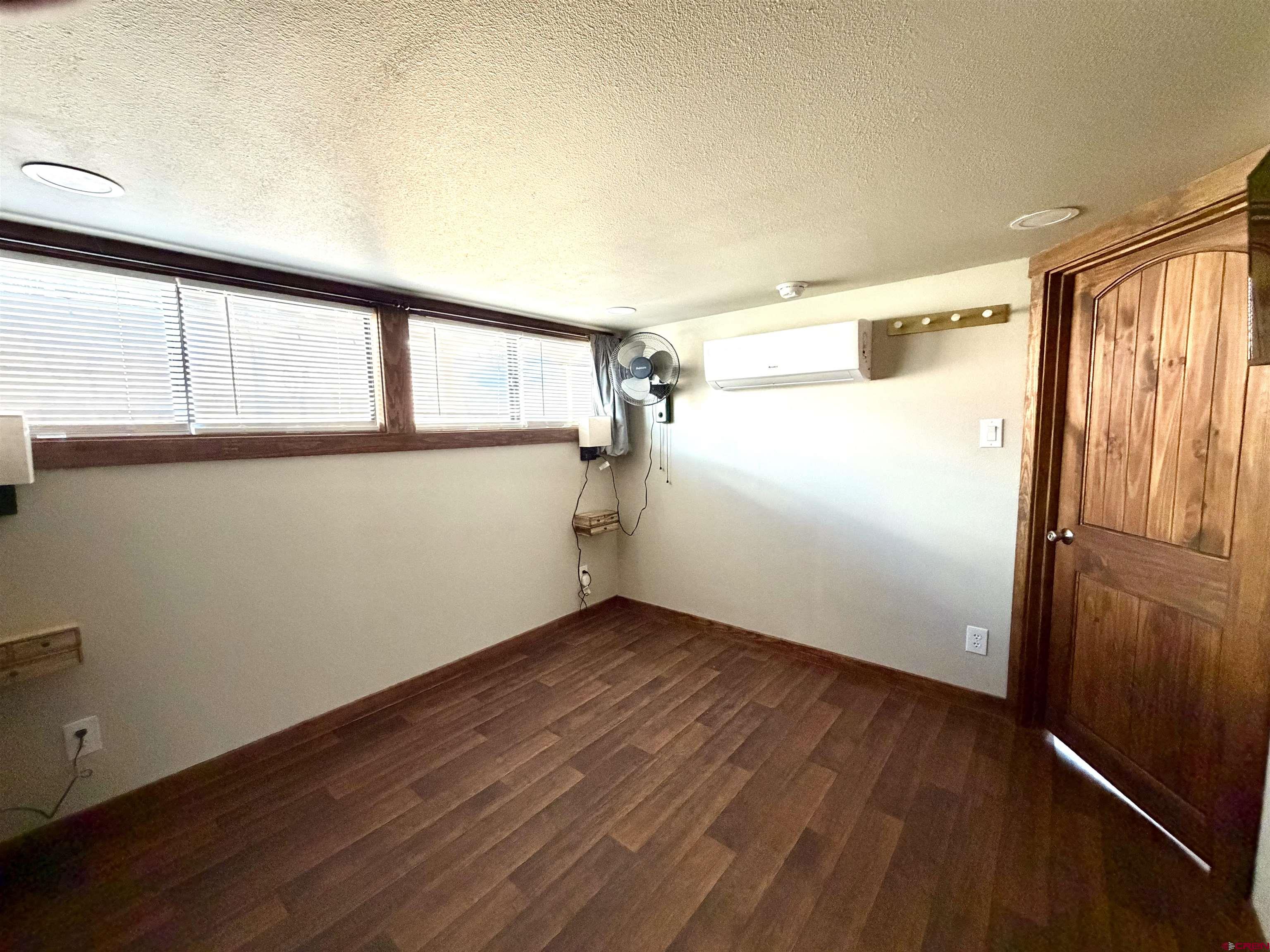 4115 County Road 17 Ridgway, CO 81432 - Photo 13 of 21 a view of an empty room with wooden floor and a window