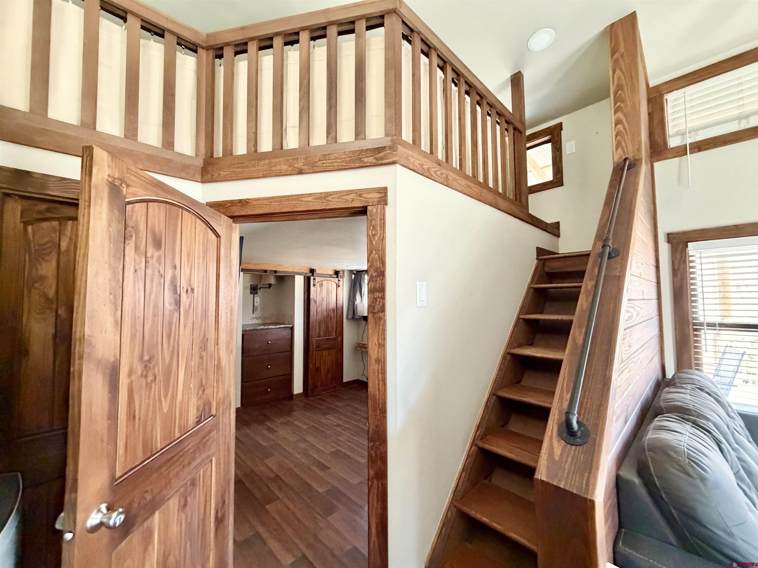 4115 County Road 17 Ridgway, CO 81432 - Photo 10 of 21 a view of entryway with wooden floor and stairs
