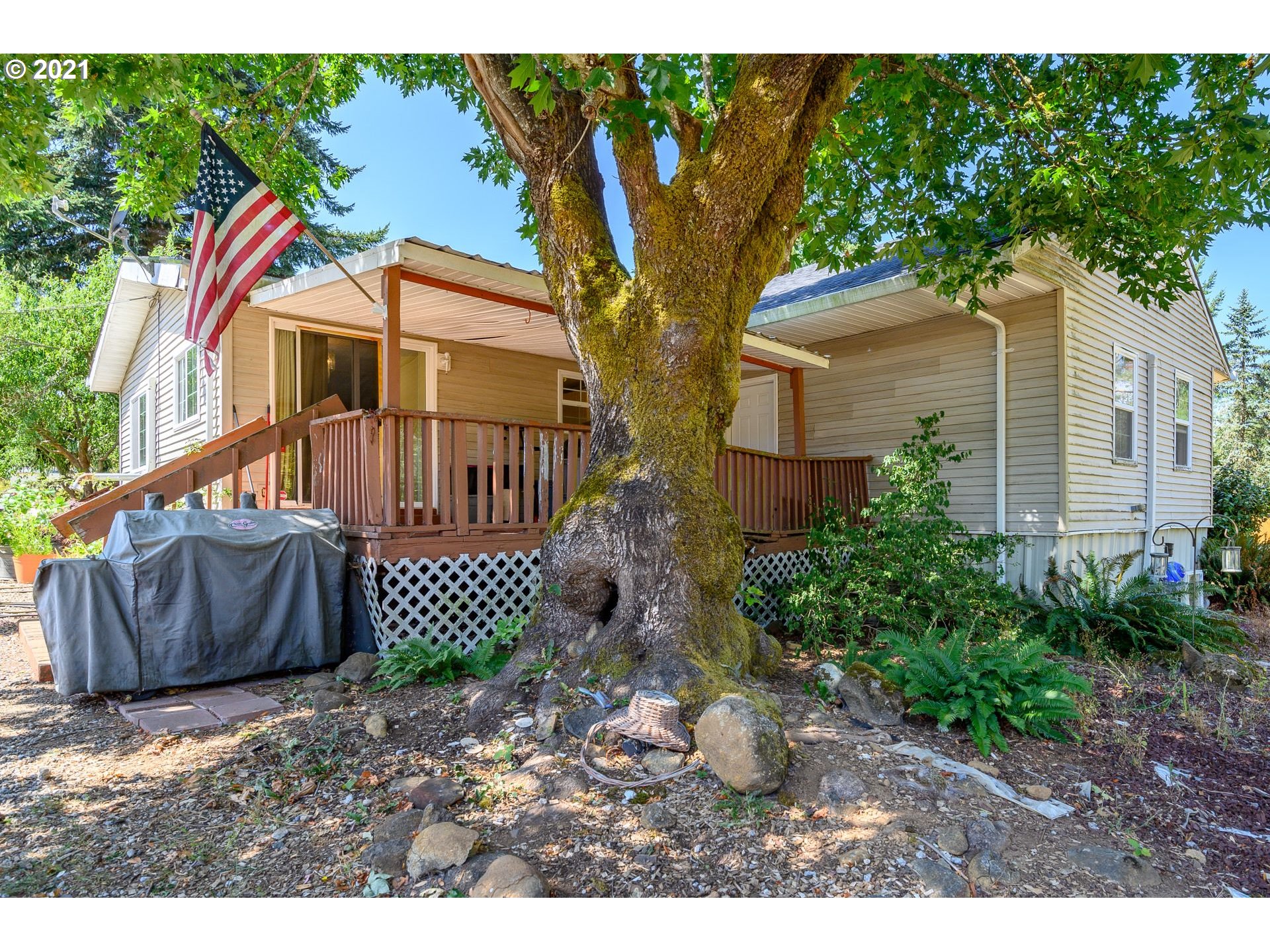 7400 Ash Street Grand Ronde, OR 97347 - Photo 2 of 23 a front view of a house with garden