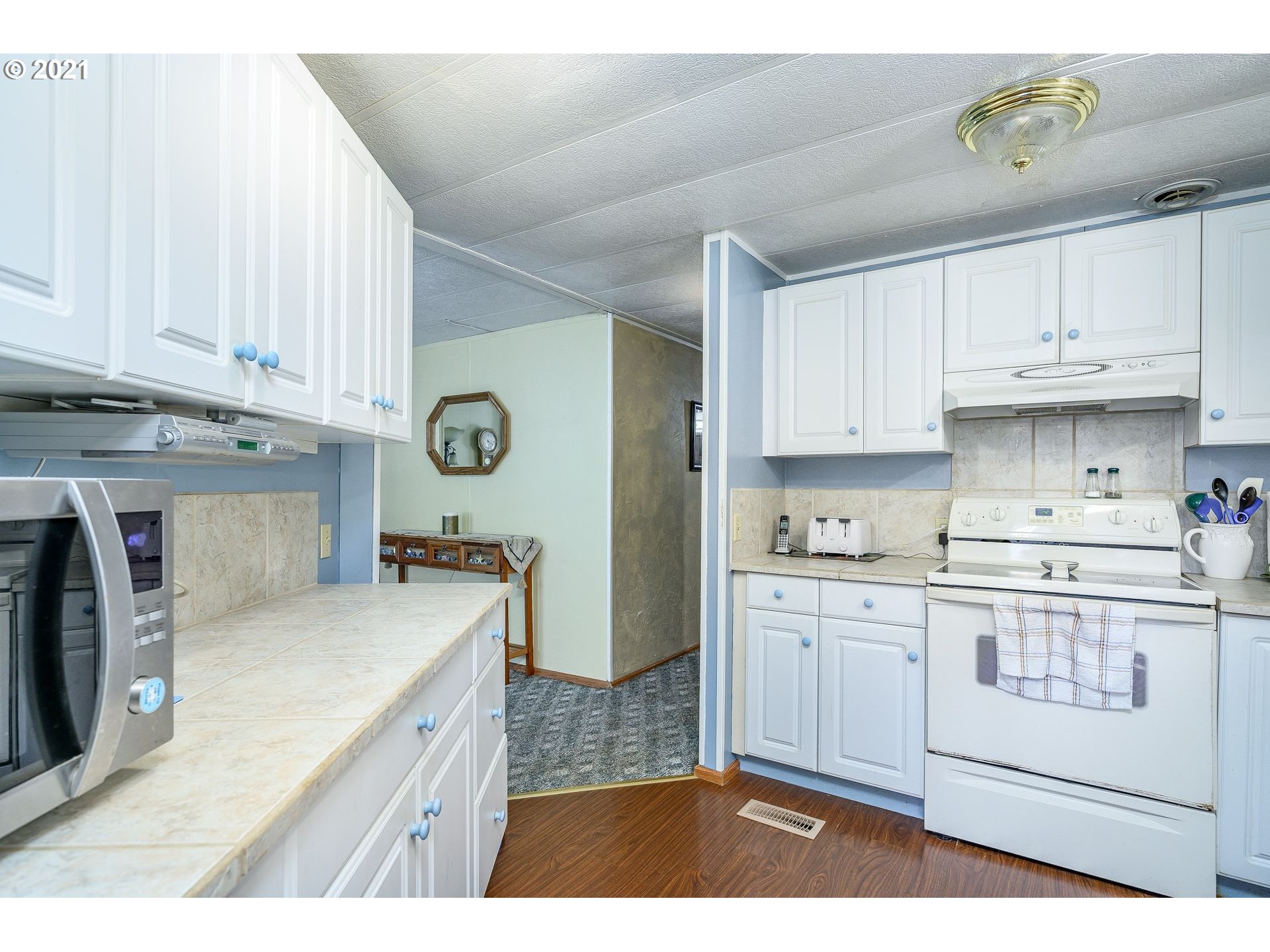 7400 Ash Street Grand Ronde, OR 97347 - Photo 11 of 23 a kitchen with stainless steel appliances granite countertop a stove a sink and a refrigerator