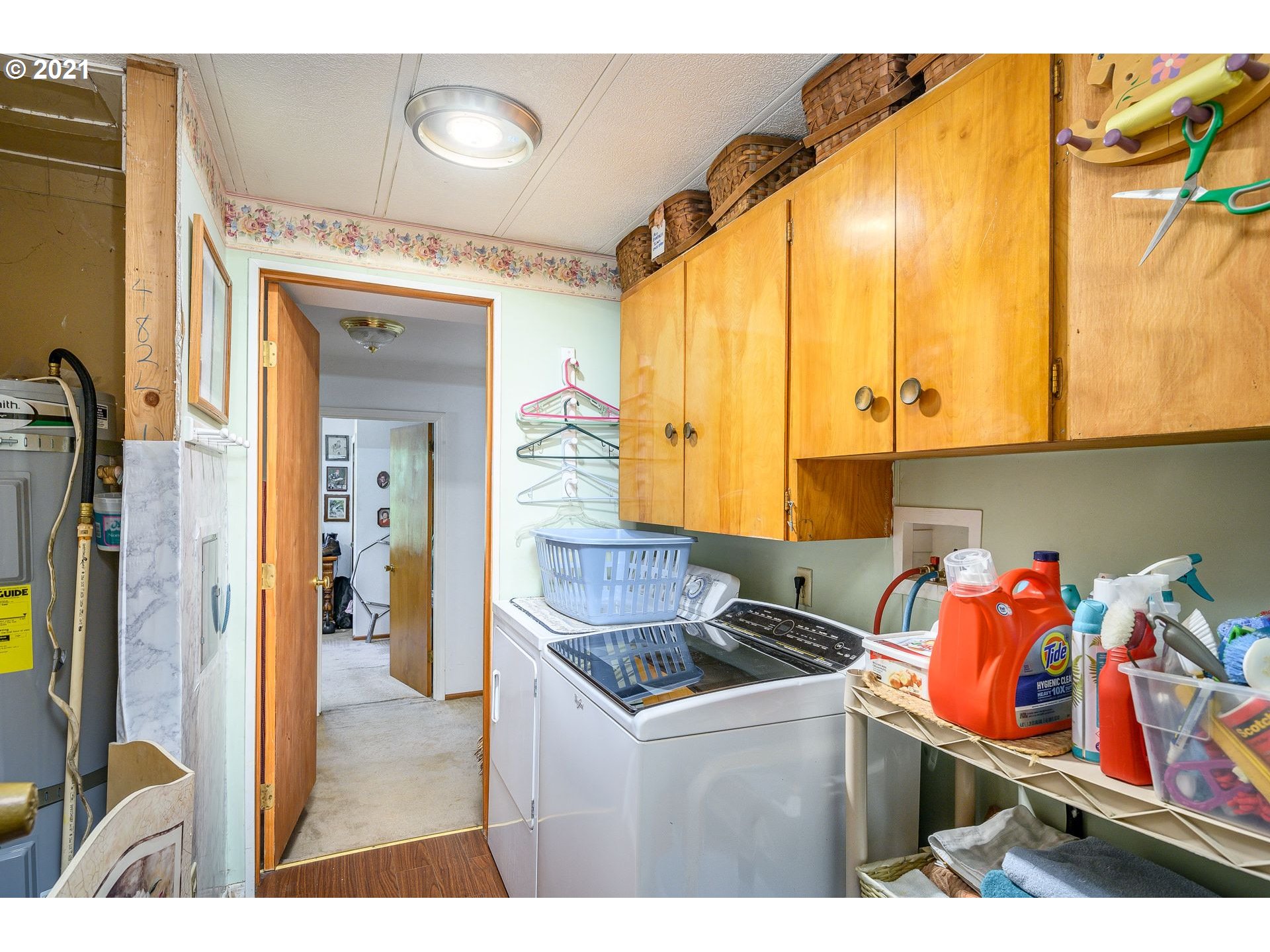 7400 Ash Street Grand Ronde, OR 97347 - Photo 19 of 23 a kitchen with stainless steel appliances granite countertop a sink and a refrigerator