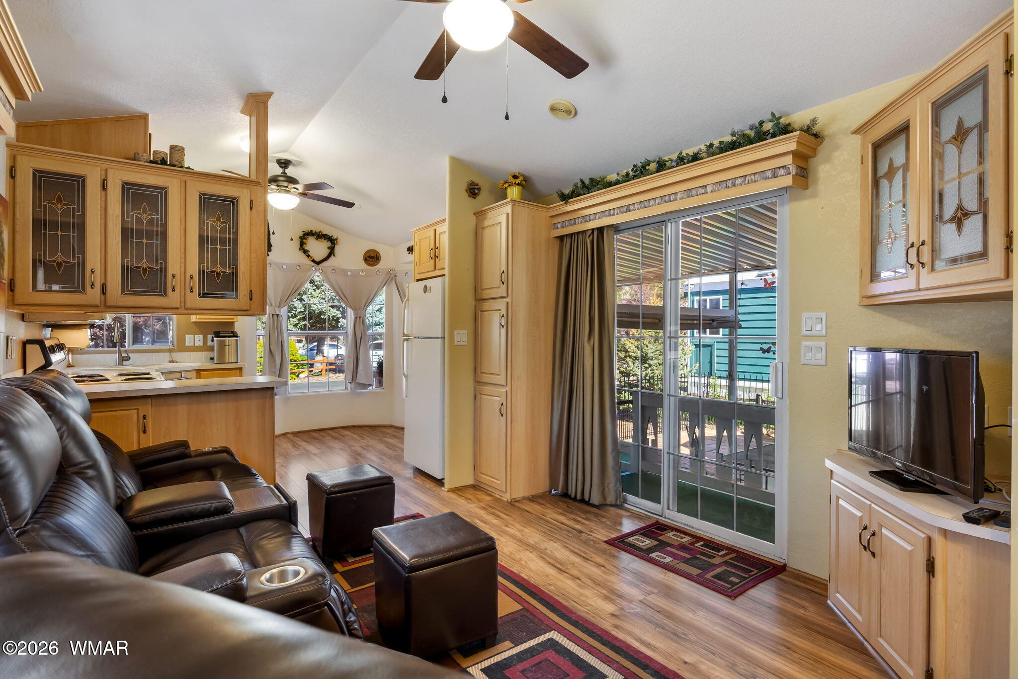2725 Whiskey Road Overgaard, AZ 85933 - Photo 12 of 32 a living room with fireplace furniture and a flat screen tv