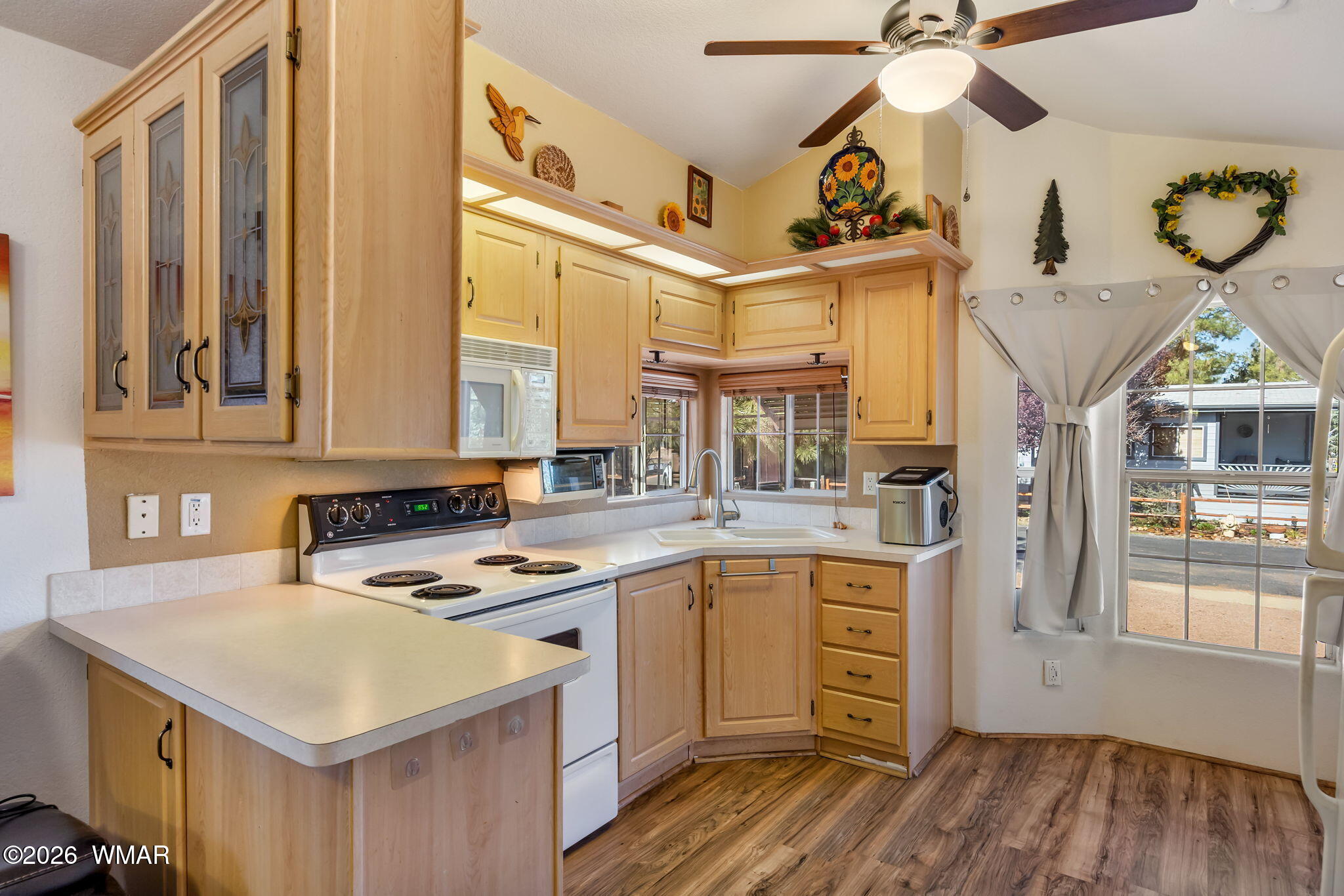 2725 Whiskey Road Overgaard, AZ 85933 - Photo 13 of 32 a kitchen with a stove cabinets and wooden floor