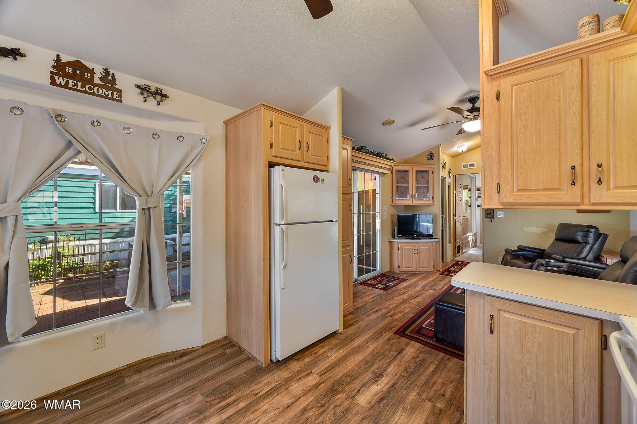 2725 Whiskey Road Overgaard, AZ 85933 - Photo 15 of 32 a kitchen with stainless steel appliances a refrigerator sink and cabinets