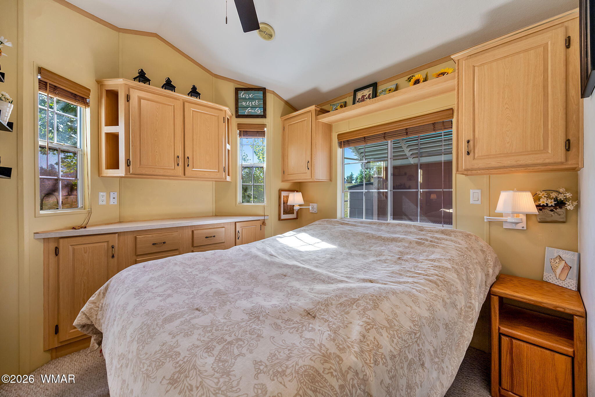 2725 Whiskey Road Overgaard, AZ 85933 - Photo 16 of 32 a bedroom with a bed dresser and a window