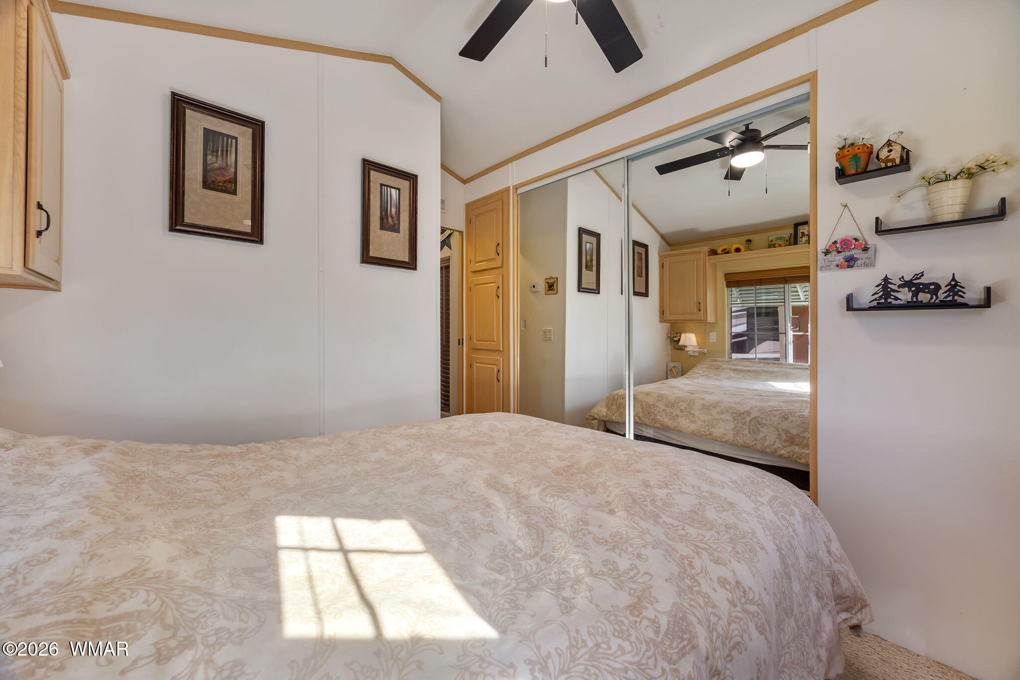 2725 Whiskey Road Overgaard, AZ 85933 - Photo 17 of 32 a bedroom with a bed and cabinets