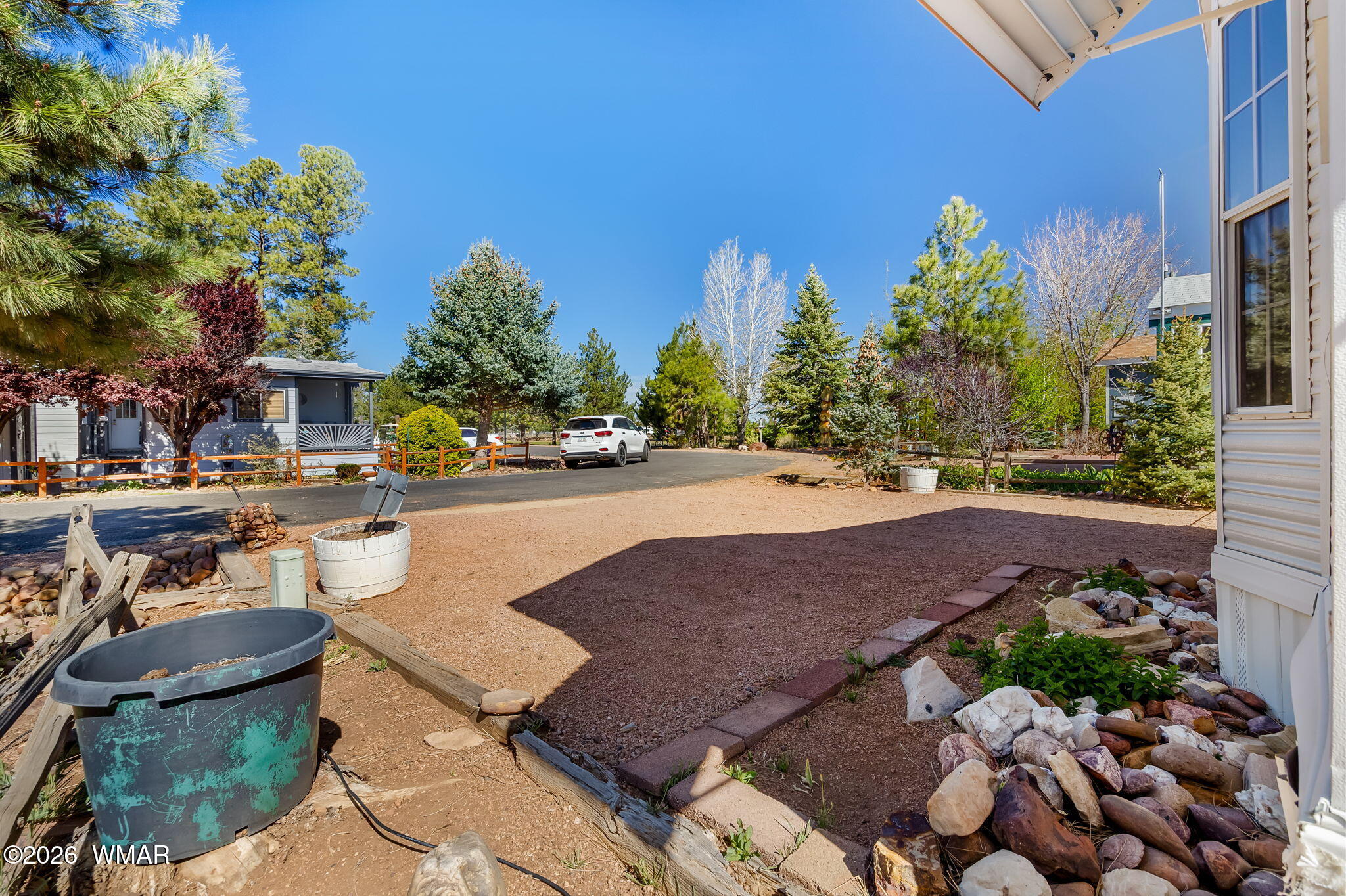 2725 Whiskey Road Overgaard, AZ 85933 - Photo 2 of 32 a view of a patio with table and chairs potted plants