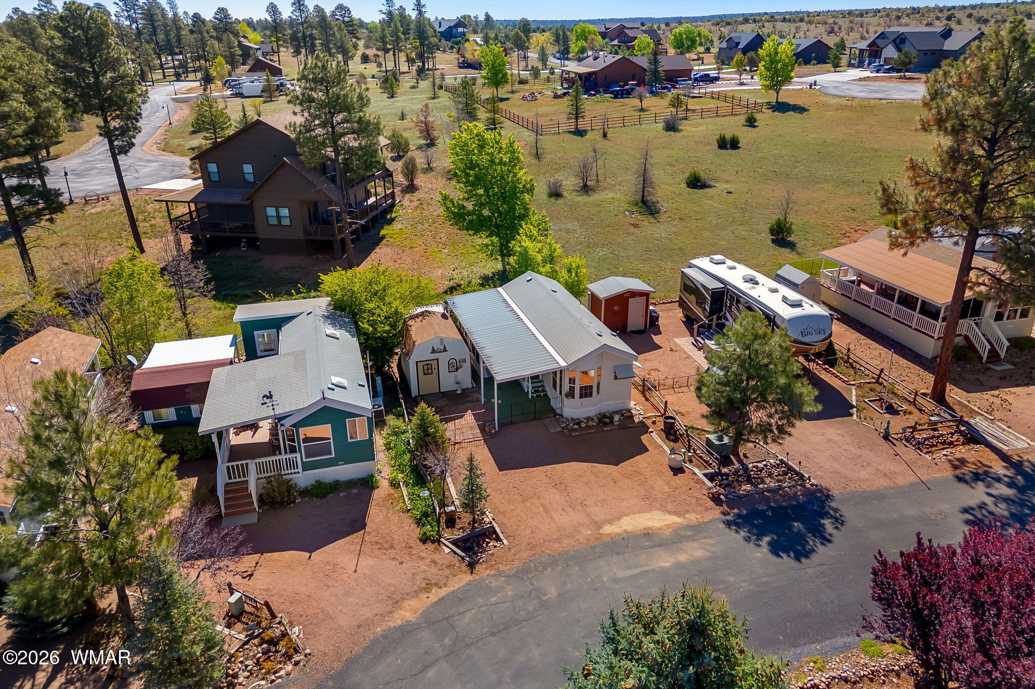 2725 Whiskey Road Overgaard, AZ 85933 - Photo 30 of 32 an aerial view of multiple houses with yard