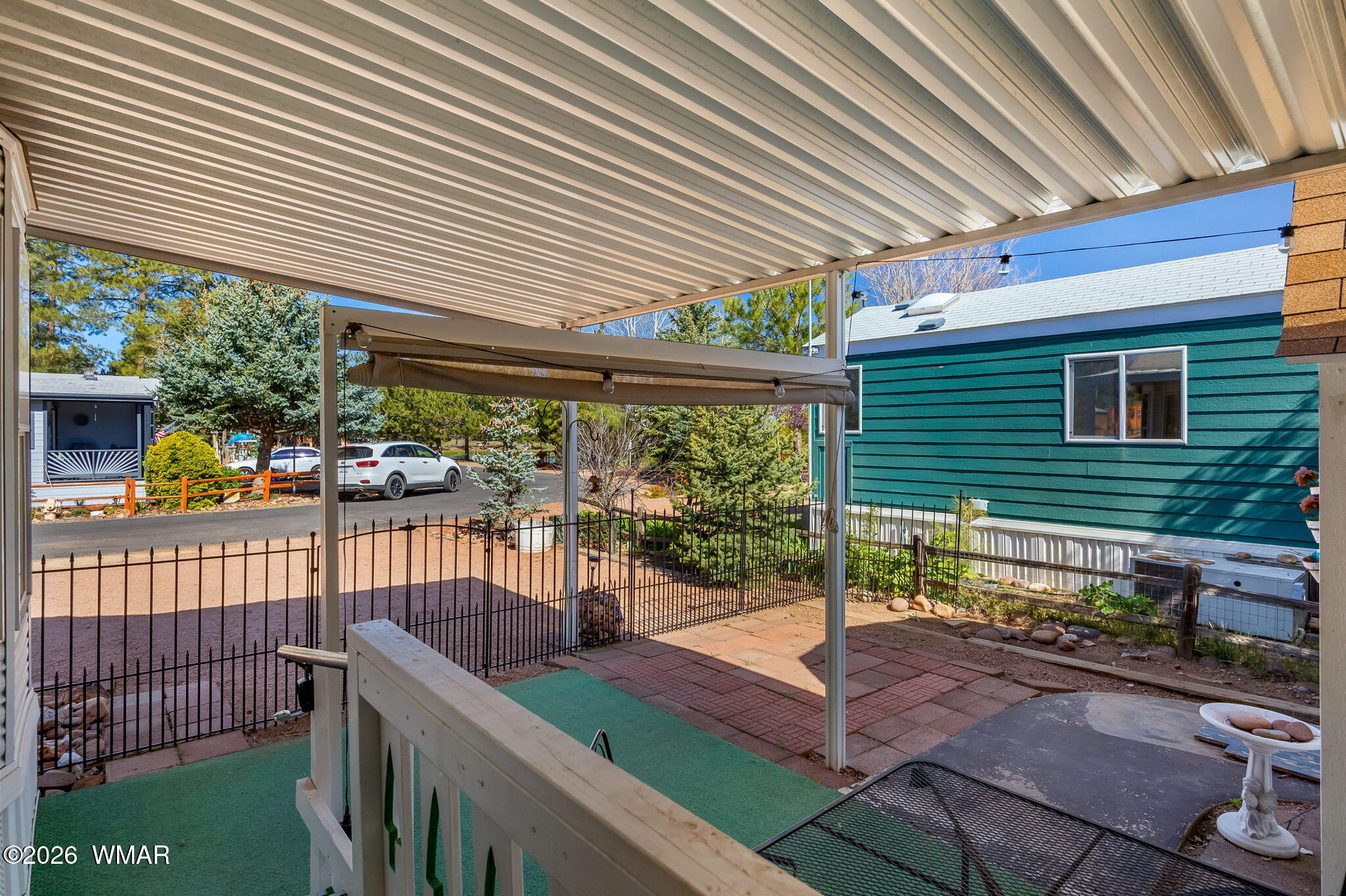 2725 Whiskey Road Overgaard, AZ 85933 - Photo 8 of 32 a view of a patio with chairs and a table