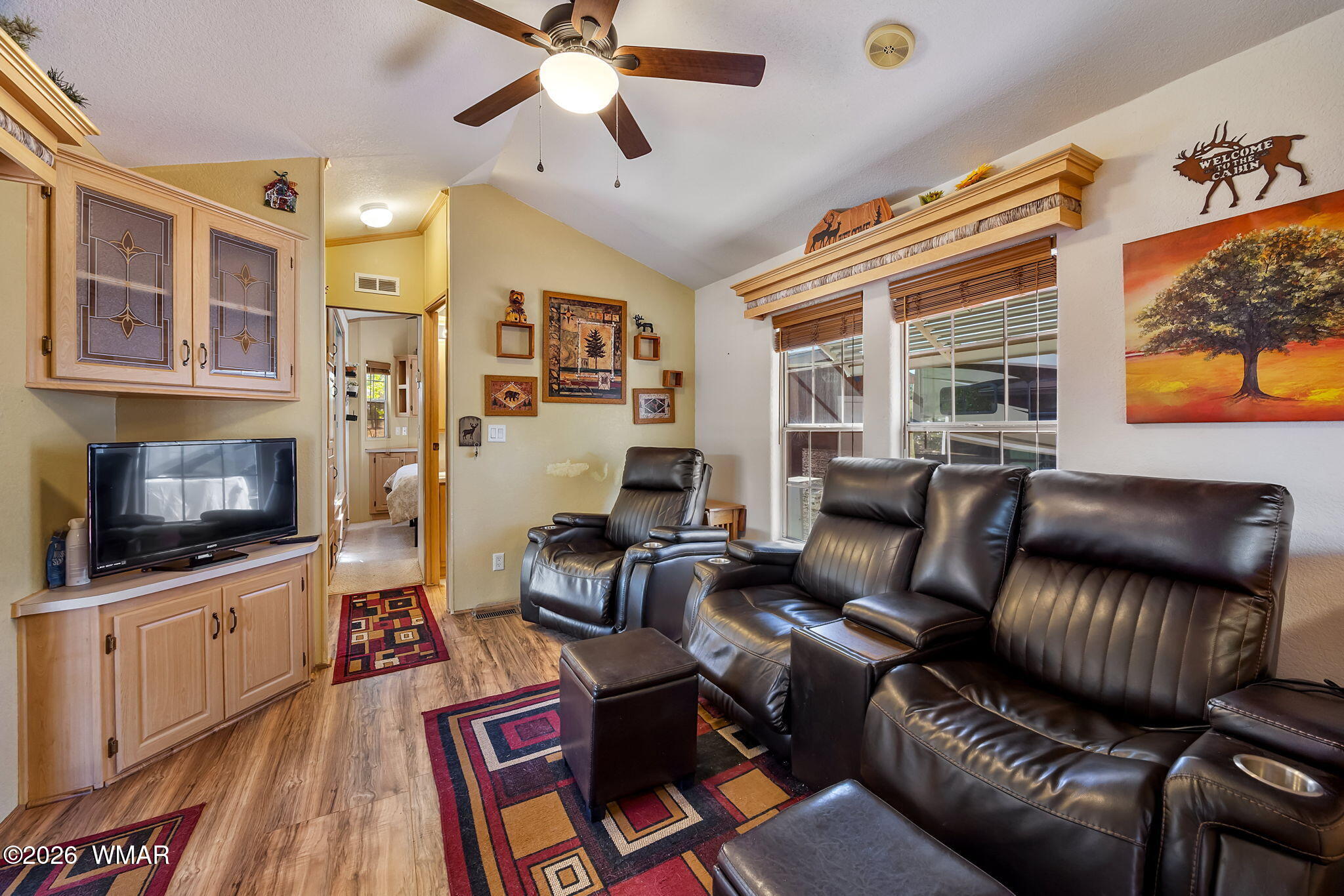 2725 Whiskey Road Overgaard, AZ 85933 - Photo 10 of 32 a living room with furniture and a flat screen tv