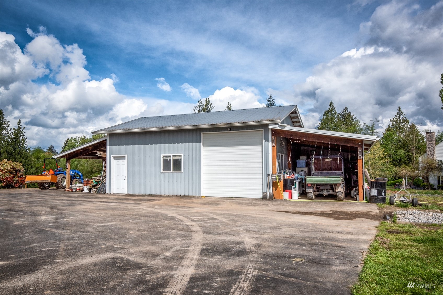 9647 Axlund Road Lynden, WA 98264 - Photo 35 of 39 a view of a house with a patio