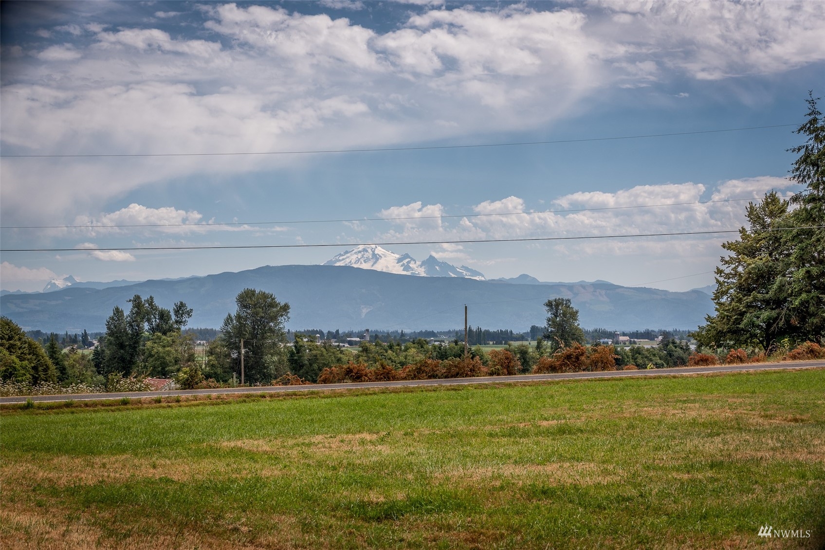 9647 Axlund Road Lynden, WA 98264 - Photo 36 of 39 a view of a golf course with a lake