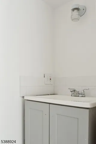 a bathroom with a sink and vanity