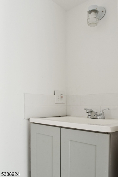 7 West Maple Avenue Succasunna, NJ 07876 - Photo 7 of 14 a bathroom with a sink and vanity