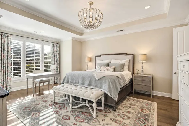 a bedroom with a bed and a table in it