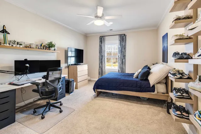 a bedroom with a workspace