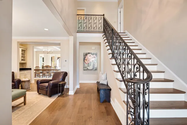 a view of entryway livingroom and hall with wooden floor