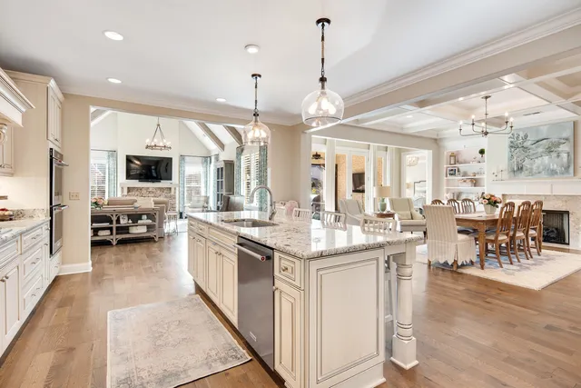 a kitchen with lots of counter top space and painting on the wall
