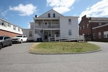a view of multiple houses with a yard