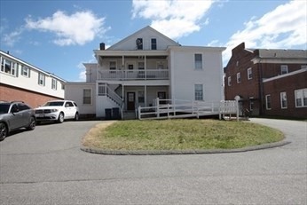 122 Elm Street, Unit C Millbury, MA 01527 - Photo 11 of 11 a view of multiple houses with a yard