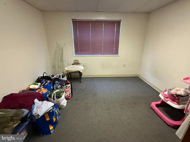 a bedroom with furniture and a couch