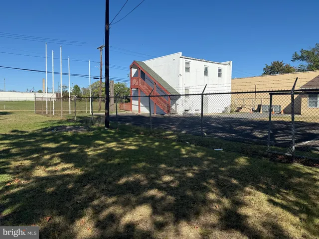 a view of a house next to a yard