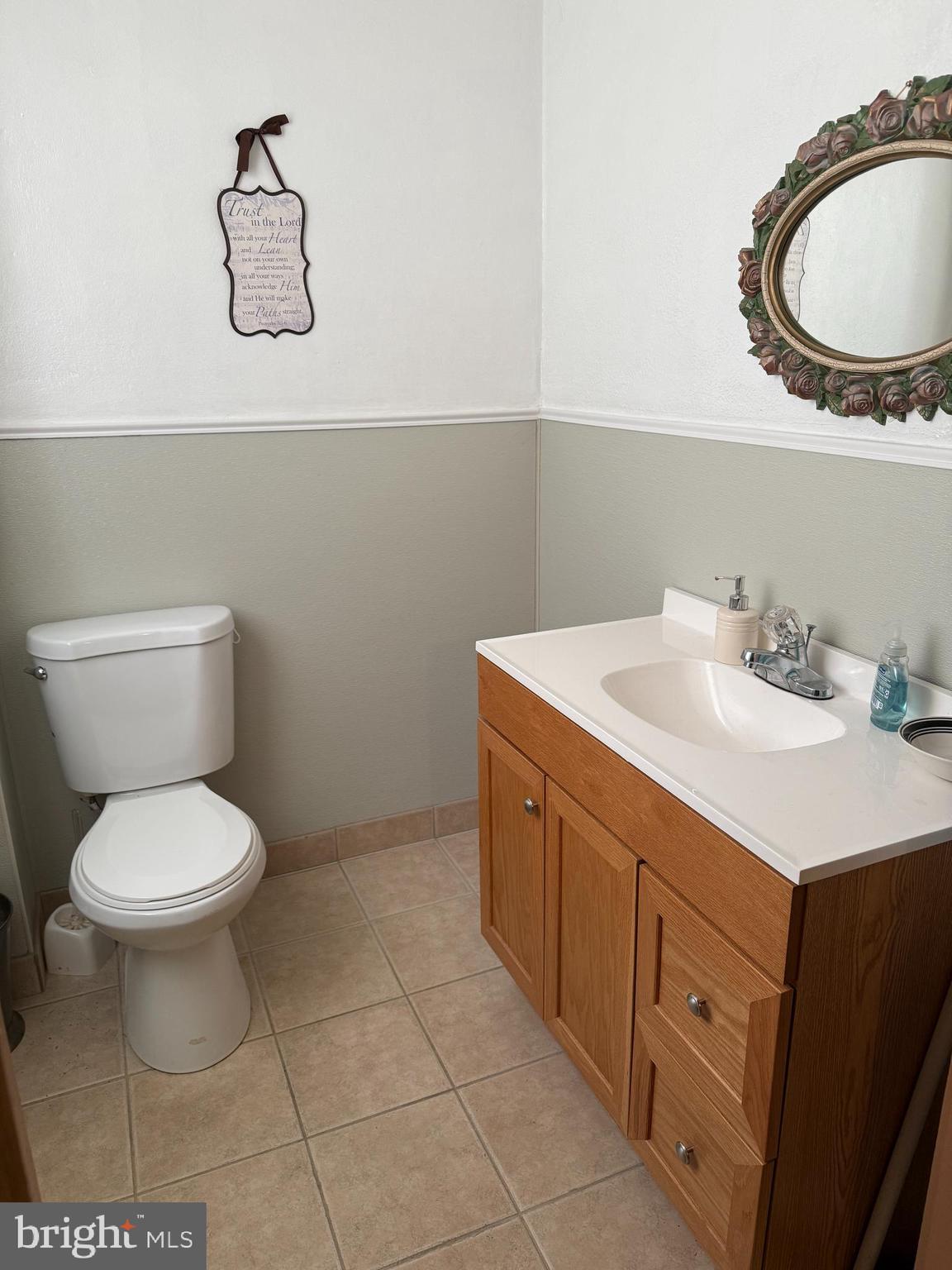 511 East Grape Street Vineland, NJ 08360 - Photo 9 of 40 a bathroom with a toilet sink and mirror