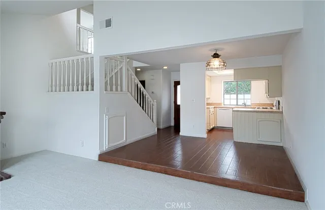 a view of kitchen with furniture and wooden floor