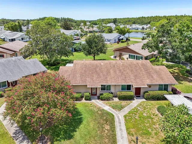 an aerial view of a house with a garden