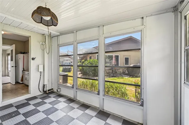 a view of a house with backyard and garden