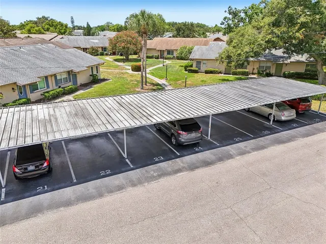 an aerial view of a residential houses with outdoor space