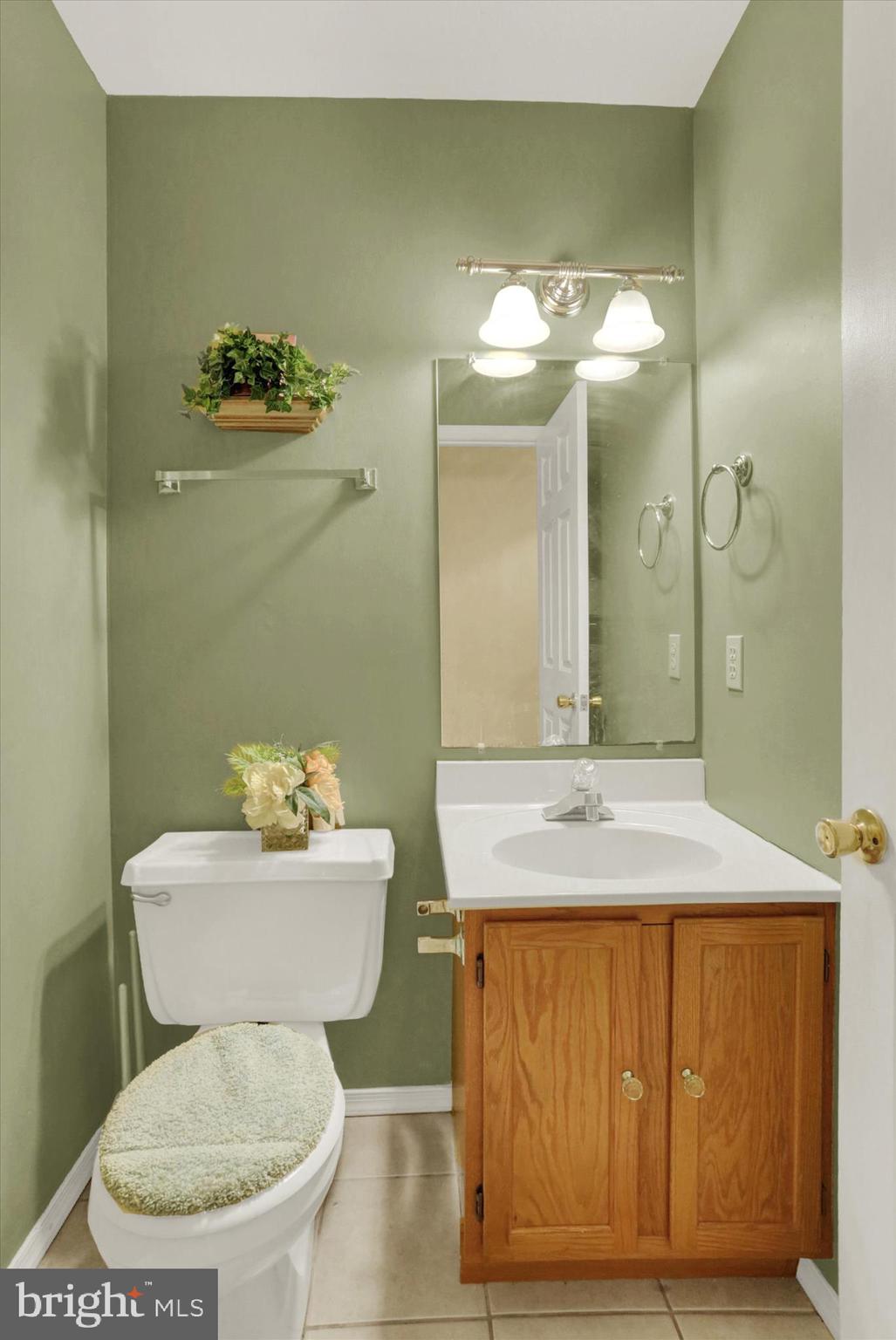 1947 Deer Path Road Harrisburg, PA 17110 - Photo 13 of 32 a bathroom with a granite countertop toilet sink and mirror