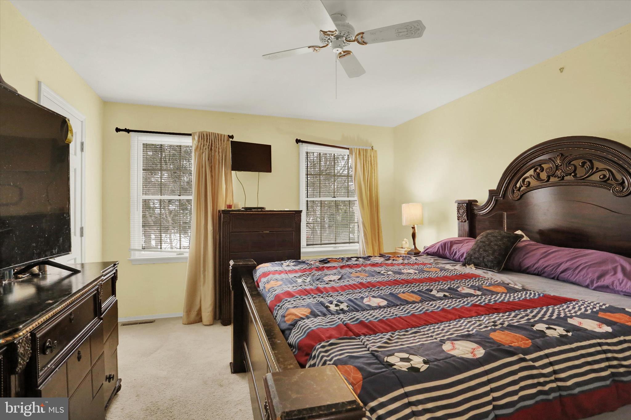1947 Deer Path Road Harrisburg, PA 17110 - Photo 16 of 32 a bedroom with a bed and a flat tv screen on the dresser
