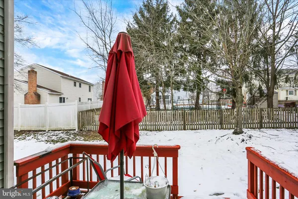 a view of a backyard with a small deck