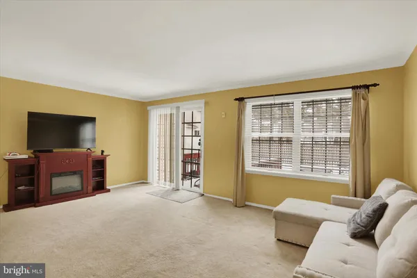 a bedroom with furniture and a flat screen tv
