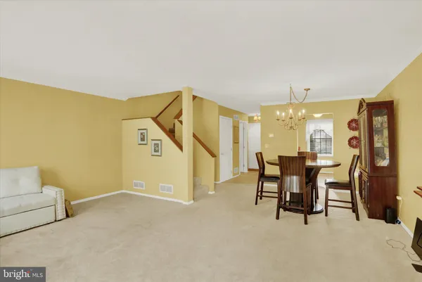 a view of a livingroom with furniture and a window