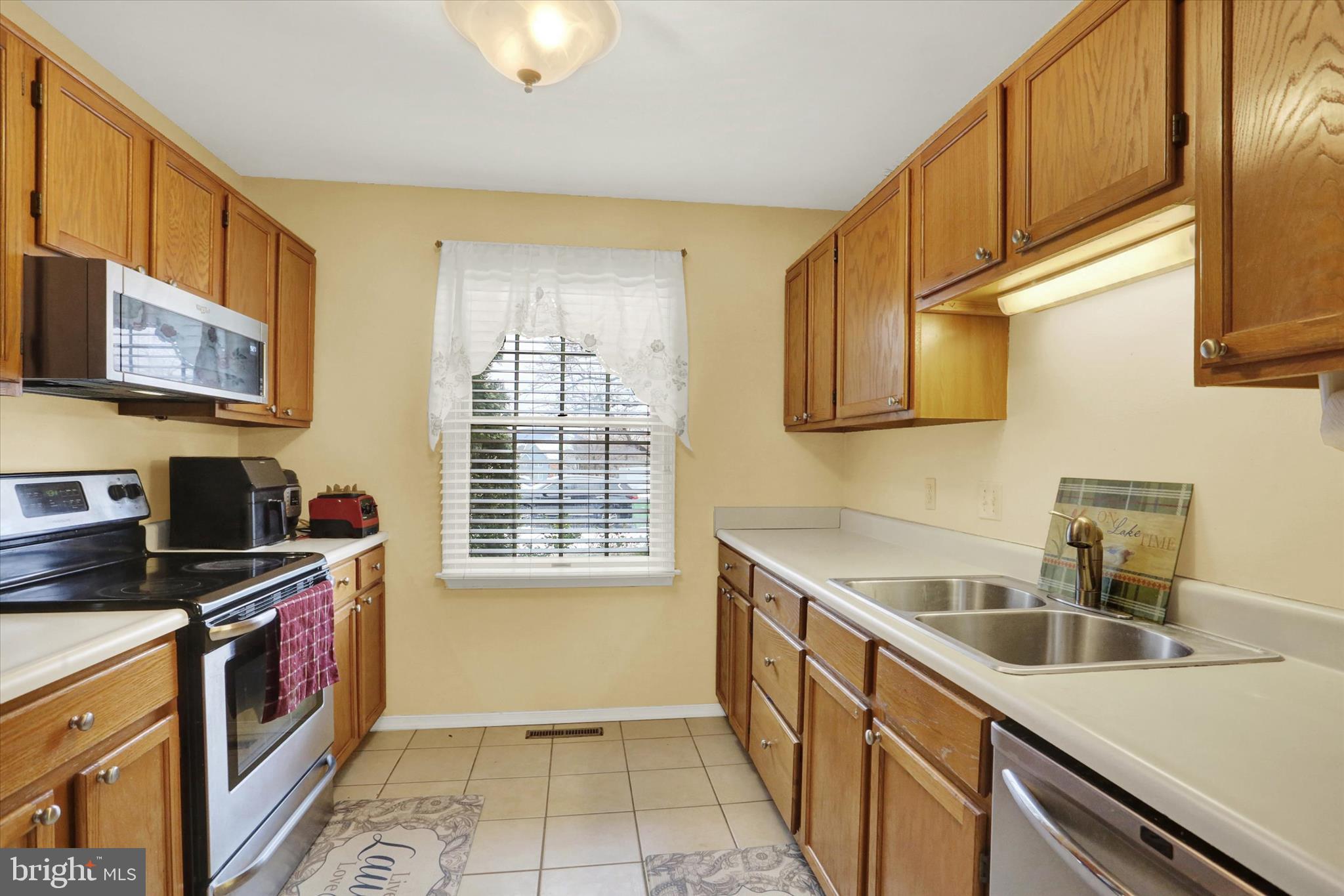 1947 Deer Path Road Harrisburg, PA 17110 - Photo 10 of 32 a kitchen that has a sink and a stove