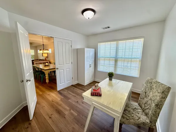 a spacious bedroom with a bed and a flat screen tv